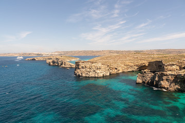 Wall Mural - Stone cliffs on the blue lagoon of the island of Comino and Gozo Malta. Mediterranean Sea
