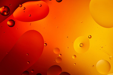 Beautiful abstract background from mixed water and oil in orange color