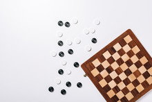 Top View Of Checkers And Chessboard On White Background