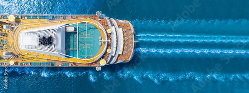 Cuadros en Lienzo Aerial view of beautiful white cruise ship above luxury cruise close up at stern of cruise sail with contrail in the ocean sea concept tourism travel on holiday take a vacation time on summer