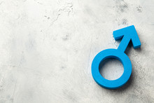 Gender Symbols Of A Man In Blue On A Gray Background
