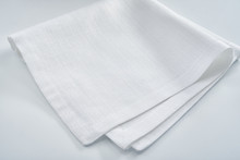 White Linen Napkin On A White Table
