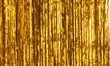 Party Background. Decor made of gold foil, tinsel and candy. Festive and cheerful mood