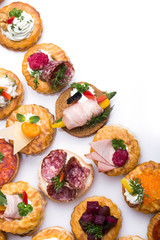 Wall Mural - Many different canapes on a white background