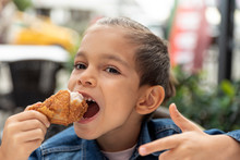 Little Boy Eats Fried Chicken
