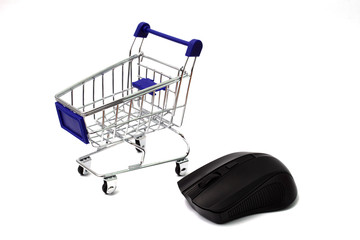 concept of online shopping, cart and computer mouse on a white background, macro, isolate