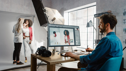 Poster - Backstage of the Photoshoot: Make-up Artist Applies Makeup on Beautiful Black Girl. Photo Editor Works on Desktop Computer Retouching Photo with Image Editing Software. Fashion Magazine