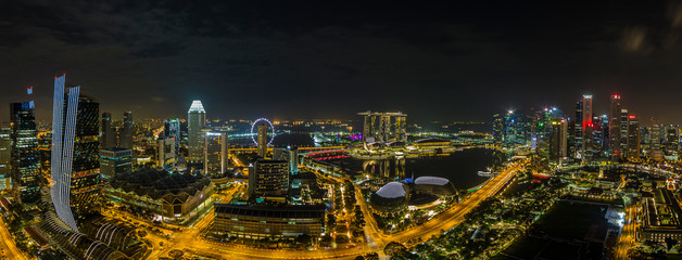 Wall Mural - Aerial panoramic picture of Singapore skyline and gardens by the bay during preparation for Formula 1 race in the night in autumn