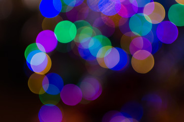 Wall Mural - Abstract Bokeh background of defocused glittering lights. Christmas, Party, New Year background pattern concept. banner