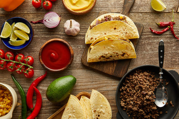 Canvas Print - Top view of ingredients for traditional mexican tacos on wooden surface