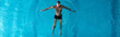 © LIGHTFIELD STUDIOS - panoramic shot of muscular swimmer training in swimming pool