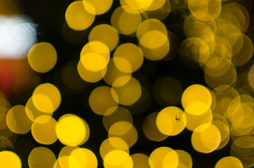 Wall Mural - Abstract Bokeh background of defocused glittering lights. Christmas, Party, New Year, luxurious background pattern concept. banner