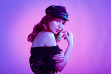 Woman Posing With Black Hat And Pink Background