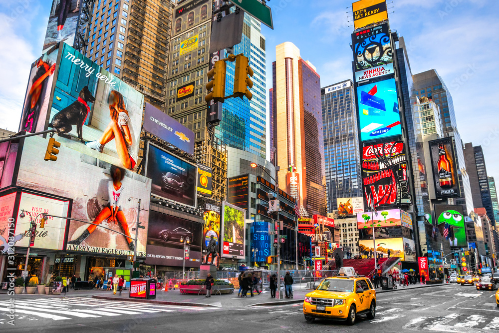NEW YORK CITY -MARCH 25, 2012: Times Square, featured with Broadway Theaters and animated LED signs, is a symbol of New York City and the United States in Manhattan, New York City. Blurred people