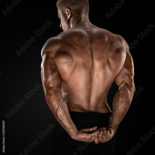 Leinwand Poster Handsome power athletic man showing his back