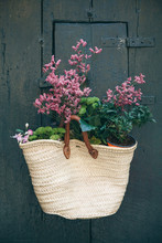 Flowers In A Bag As A Decoration On A Wooden Surface Or Door. Inspiration Or Decoration Idea