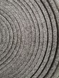 Roll of foam plastic material. Thermal insulation for construction technology. Abstract industrial and geometric background with helix or spiral pattern and curvy tracks in black and white.