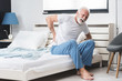 Senior man suffering from pain at home