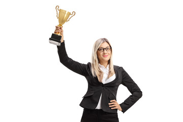 Wall Mural - Businesswoman with a golden trophy cup