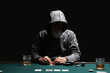 Male cardsharper playing in casino