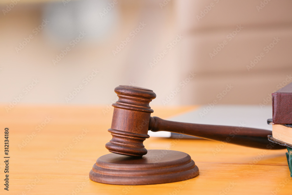 Judge's gavel on table in office