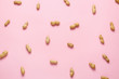 Tasty peanuts on color background