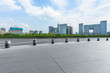 © hallojulie - Panoramic skyline and buildings with empty square floor.