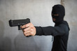 © sorapop - Robbed man hand holding and point gun