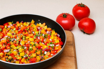 Sticker - Mixed vegetables on a frying pan.