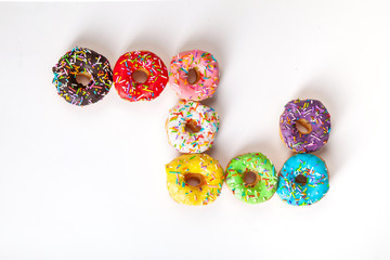 Wall Mural - colorful doughnuts white background studio