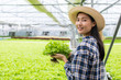 © khwanchai - Farmer woman holding hydroponic in farm