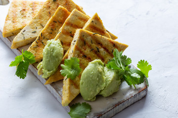 Poster - Grilled herbed tofu with avocado cream,  vegan meal, plant based diet