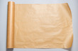 Roll of baking paper on grey background