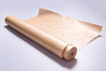 Roll of baking paper on grey background