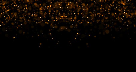 Wall Mural - abstract waterfalls of golden glitter sparkle bubbles particles bokeh on black background,christmas and happy new year holiday