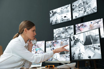 Poster - Security guard talking on telephone at workplace