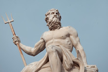 The Mighty God Of The Sea And Oceans Neptune (Poseidon) The Ancient Statue Against Blue Sky.