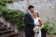 © Margo Basarab - Happy bride and groom near old castle in wedding day