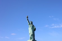 Statue Of Liberty In Front Of Blue Sky