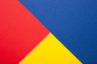 Red, blue and yellow paper texture as background with place for text