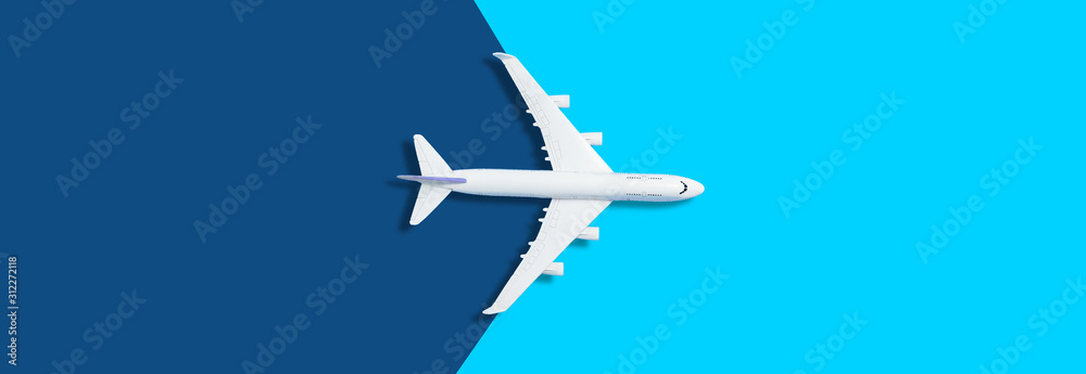Flat lay design of travel concept with plane on blue background with copy space - obrazy, fototapety, plakaty 