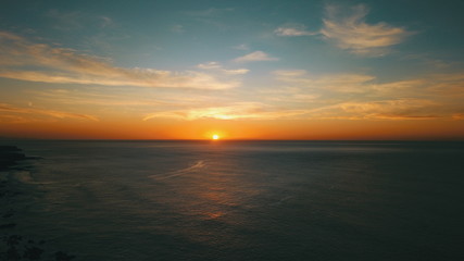  Landscape and sunset on the coast contemplating the breaking of the waves on the cliffs