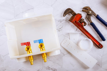 Wall Mural - Washer dual drain outlet box and adjustable monkey wrench