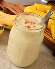 Wall Mural - Delicious orange banana smoothie closeup