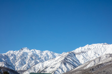 Wall Mural - 青空と自然の雪山の景色コピースペース　mountain