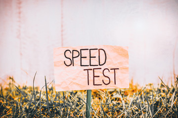 Poster - Handwriting text writing Speed Test. Conceptual photo psychological test for the maximum speed of performing a task Plain empty paper attached to a stick and placed in the green grassy land