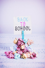 Poster - Writing note showing Back To School. Business concept for New Teachers Friends Books Uniforms Promotion Tuition Fee Reminder pile colored crumpled paper clothespin wooden space
