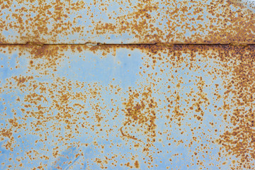 Wall Mural - Rusty metal background . Corroded metal sheet with paint residue. Rust on an old metal background