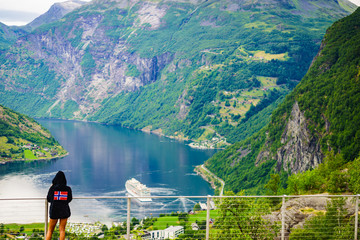 Sticker - Tourist over fjord wearing norwegian flag clothing