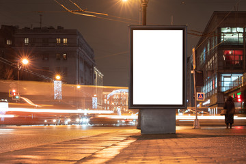 Wall Mural - Vertical advertising billboard urban. city format in the night city. Luminous advertising field Mockup in town. Driving blurry cars nearby